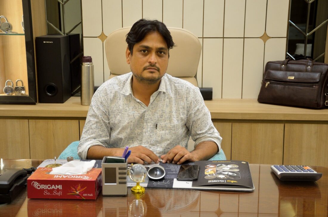 Mohd. Anas, founder of A R Enterprises, at his desk with the Gusto Locks catalogue